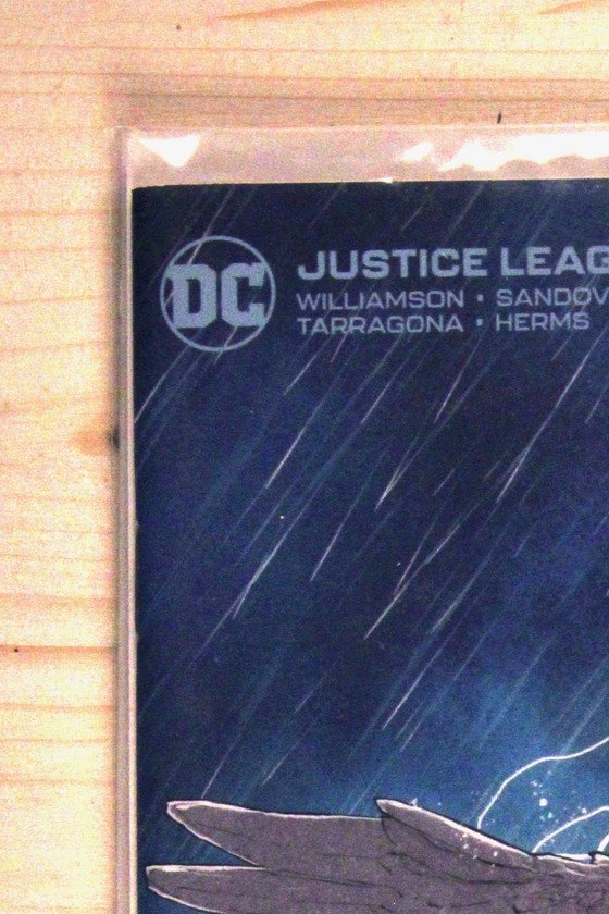 Justice League #75 – DC (2022) 9.6 NM+ Variant Cover by Mikel Janín - features the Justice League depicted as stone statues/monument in a stormy graveyard setting