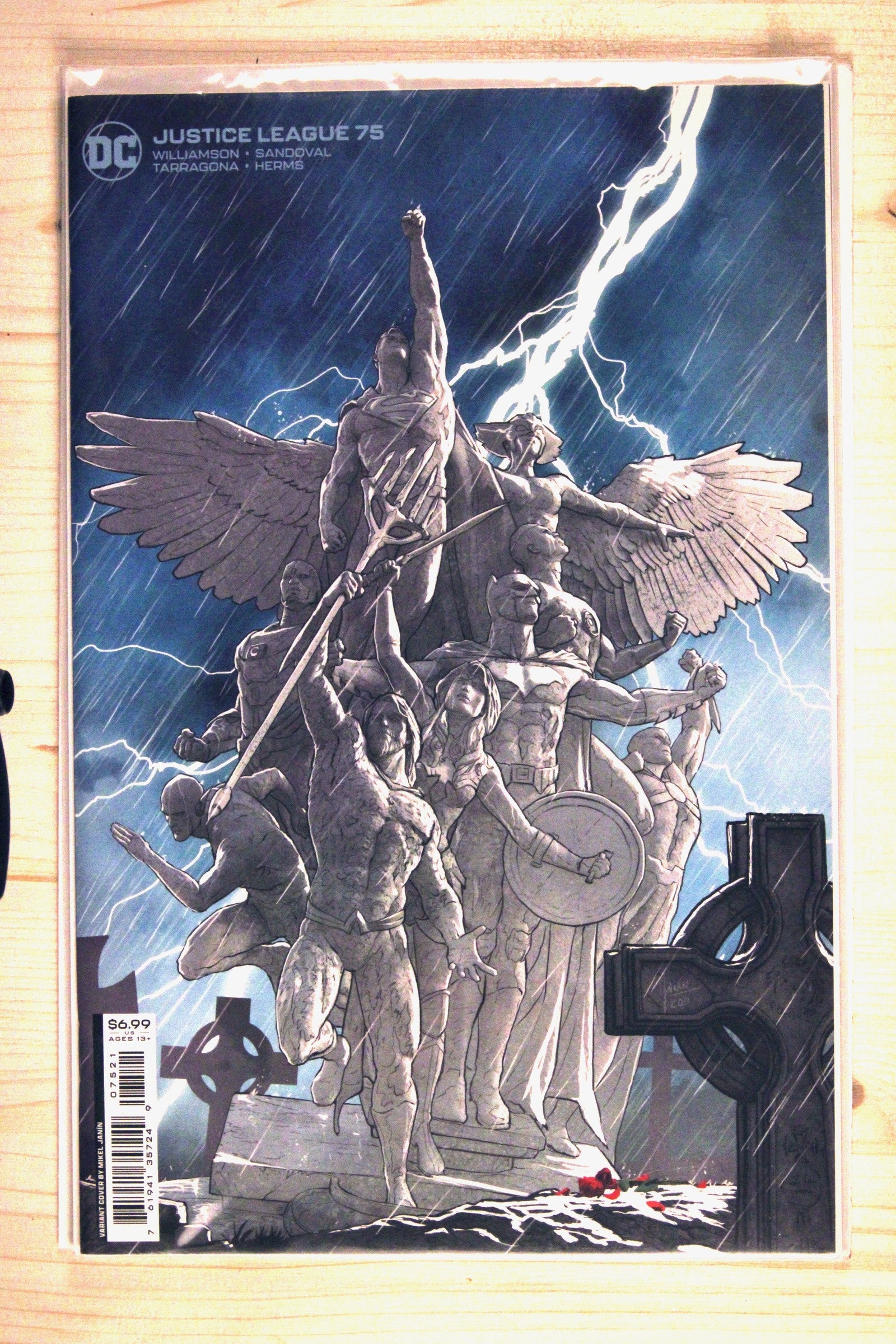 Justice League #75 – DC (2022) 9.6 NM+ Variant Cover by Mikel Janín - features the Justice League depicted as stone statues/monument in a stormy graveyard setting